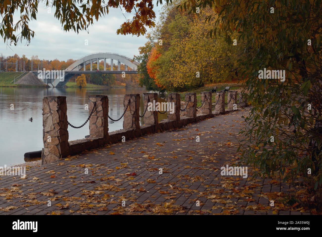 View of the autumn park and the railway bridge over the Moscow Canal Stock Photo