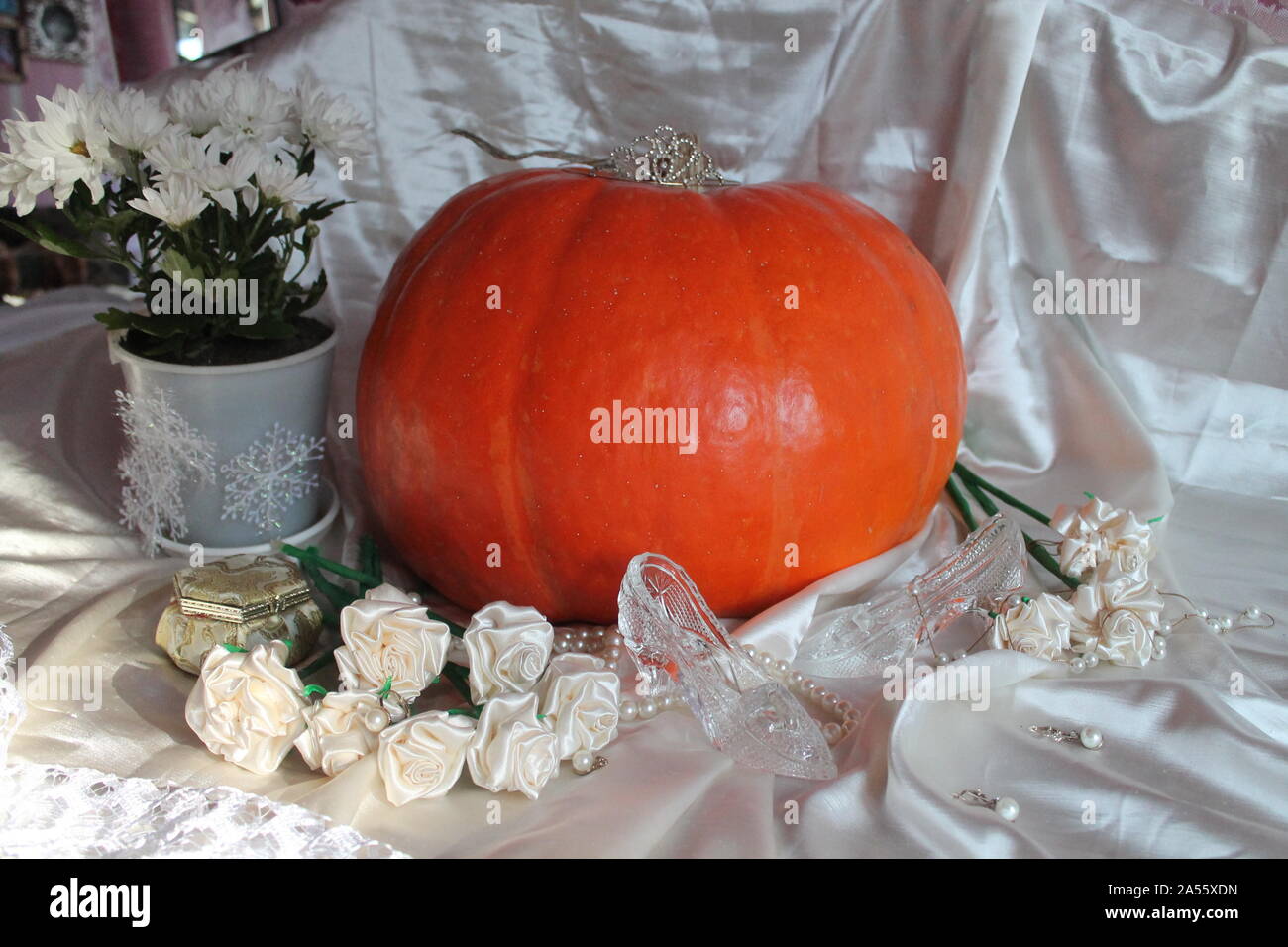 beautiful big juicy pumpkin decorated pearl bead, shoe cinderella story for  prepare on Halloween holiday Stock Photo