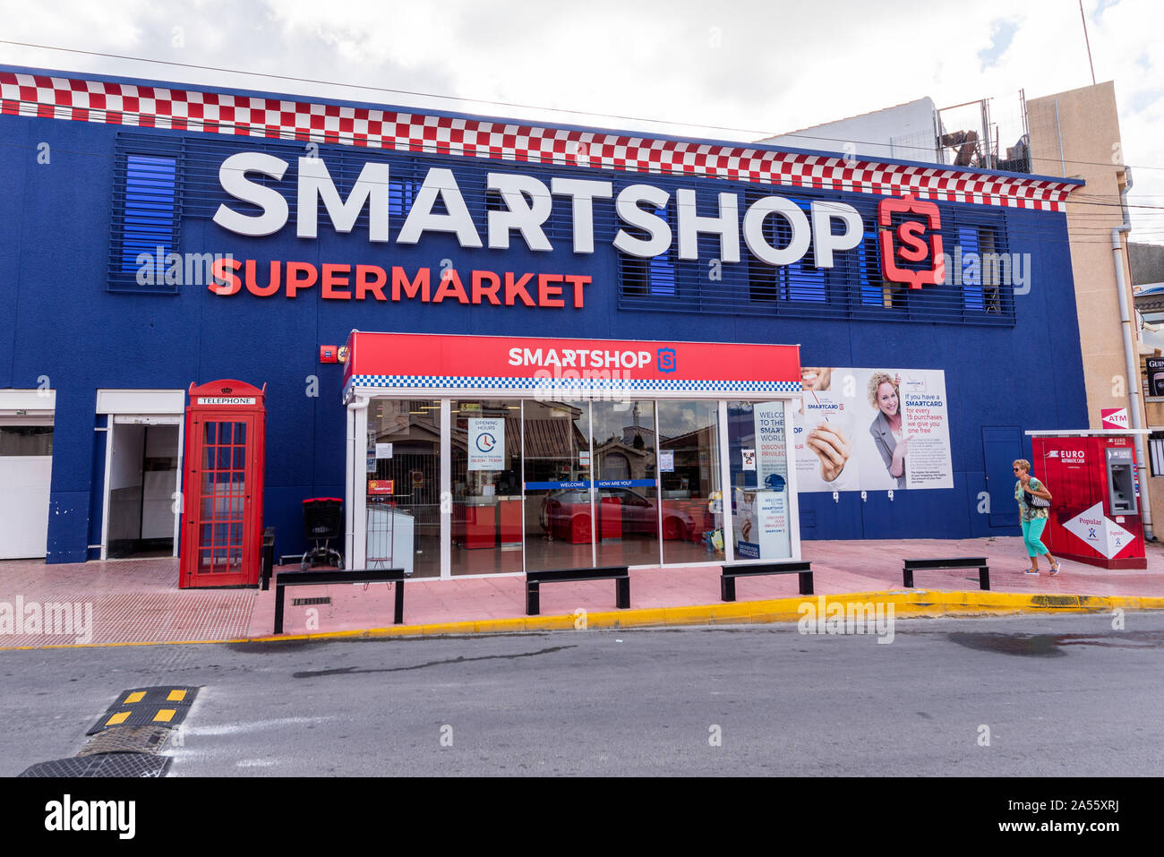 Smartshop Supermarket English, British oriented shop store in Ciudad Quesada, Rojales Spain. Brits abroad. Appealing to ex-pats with red telephone box Stock Photo