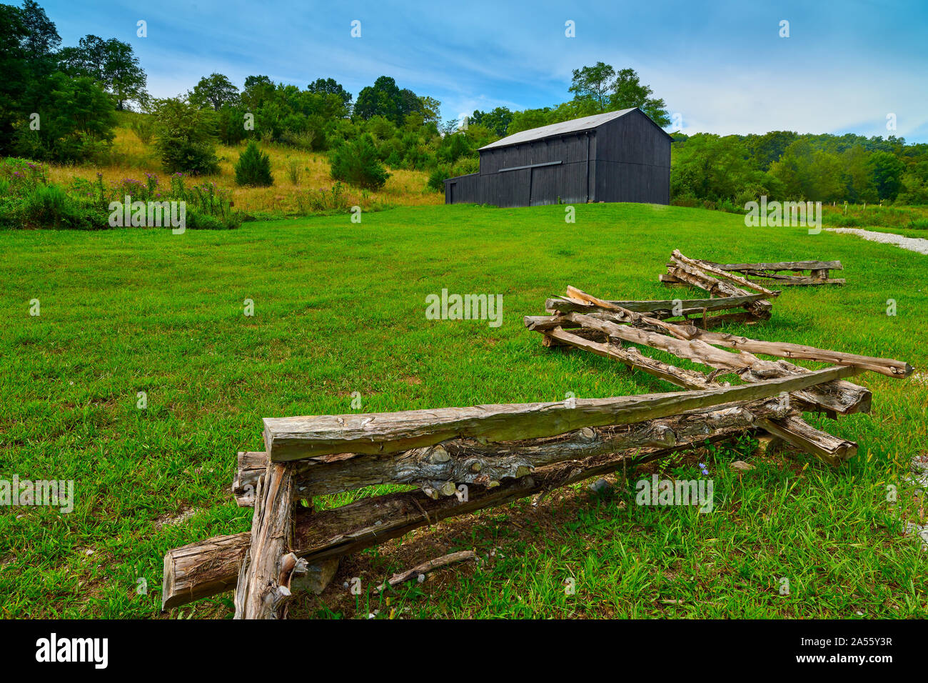 Old KY barn with stlit rail fence. Stock Photo