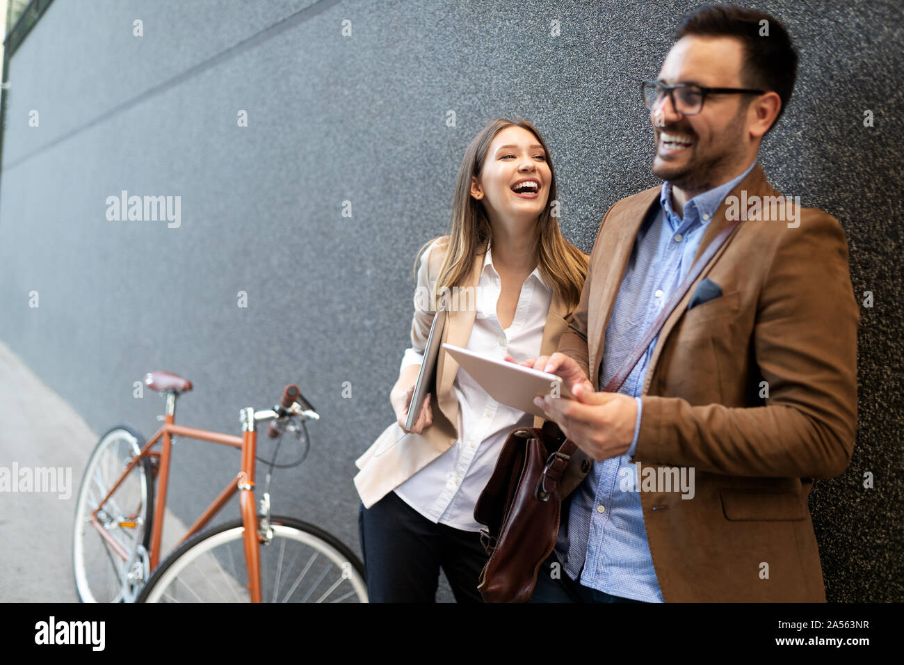 Loving couple walking, smiling having fun in the city Stock Photo