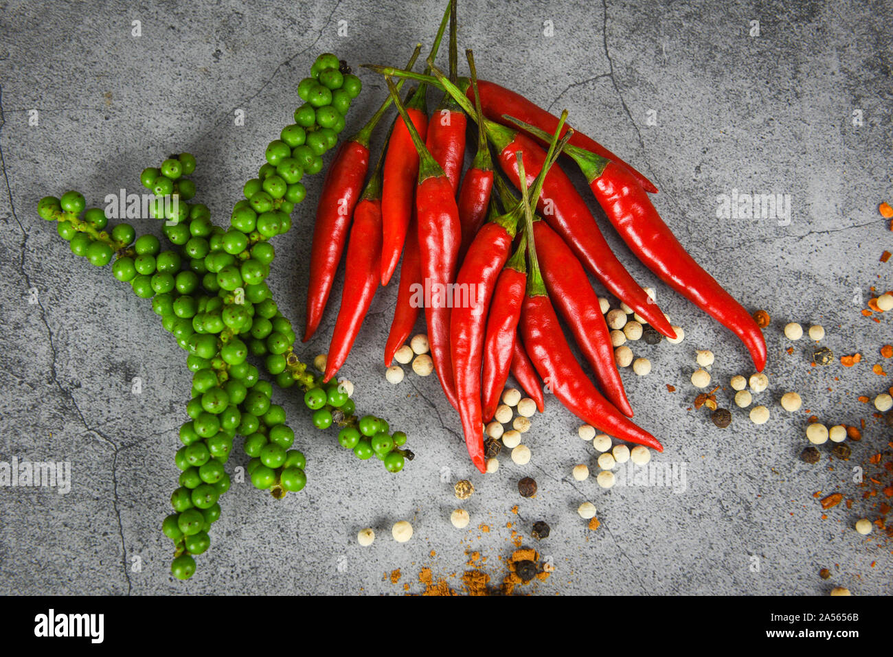 Peppercorns And Fresh Red Chilli On Dark Background Fresh Green Peppercorn And Pepper Seed For Ingredients Cuisine Thai Food Herbs And Spices Stock Photo Alamy