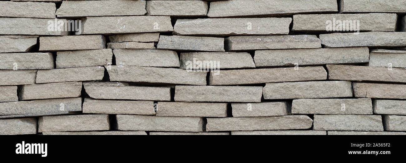 Background wall small light brown textural decorative brick Stock Photo