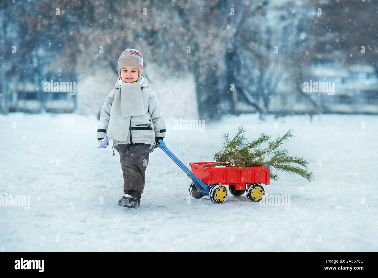 Boy pulling wagon hi-res stock photography and images - Alamy