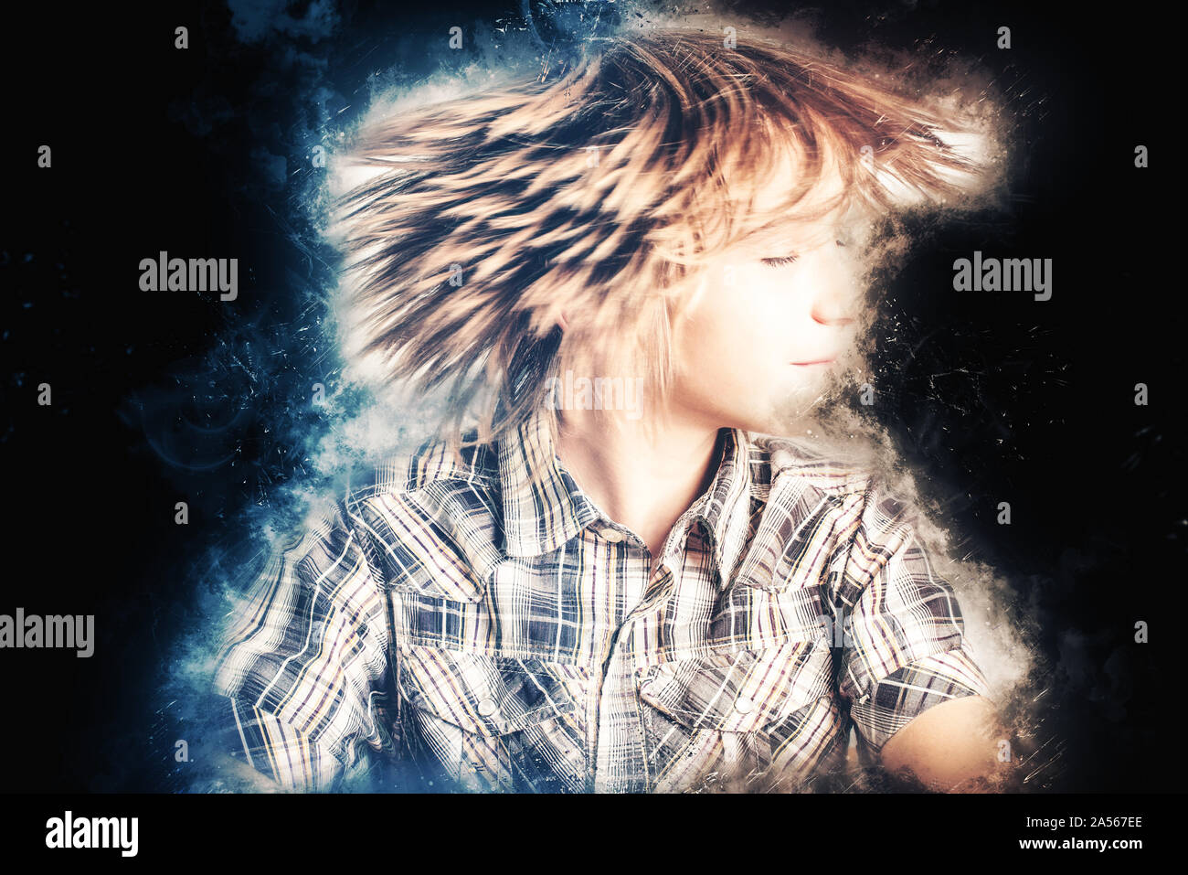 little boy dreamer on black background Stock Photo