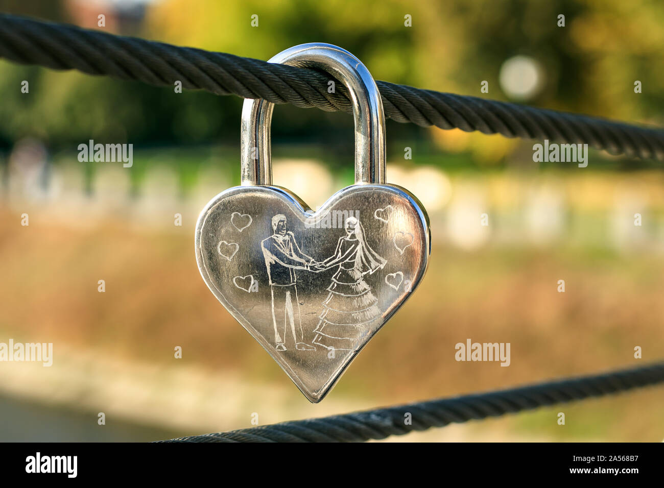 Engraved metal padlock in the shape of heart. Symbol of love. Romantic concept Stock Photo Alamy