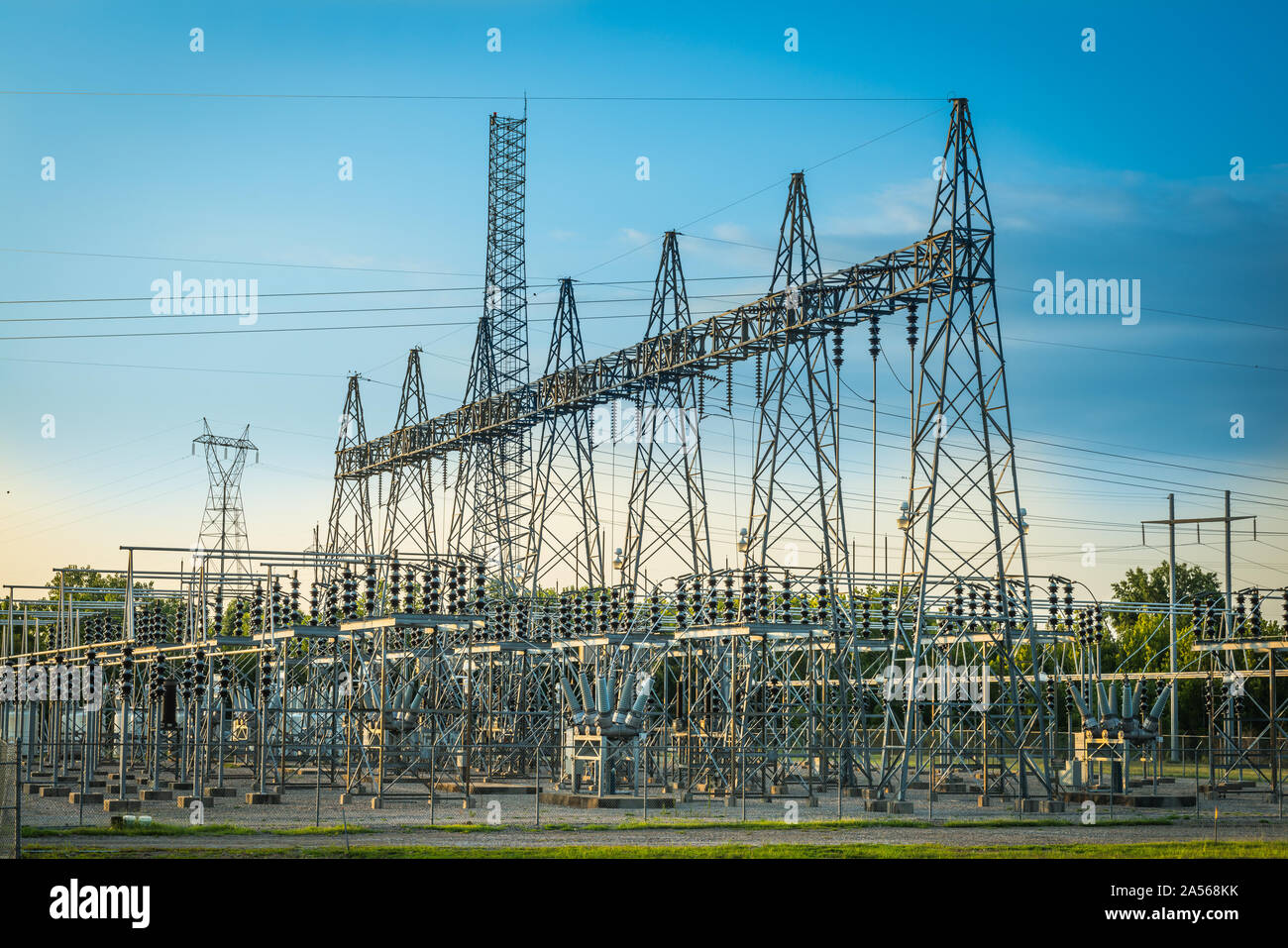 Electric substation at sunset with blue sky. Stock Photo