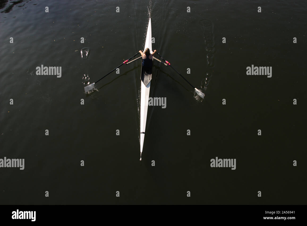 Aerial view of a rower rowing a single skull in Oxford on the Thames