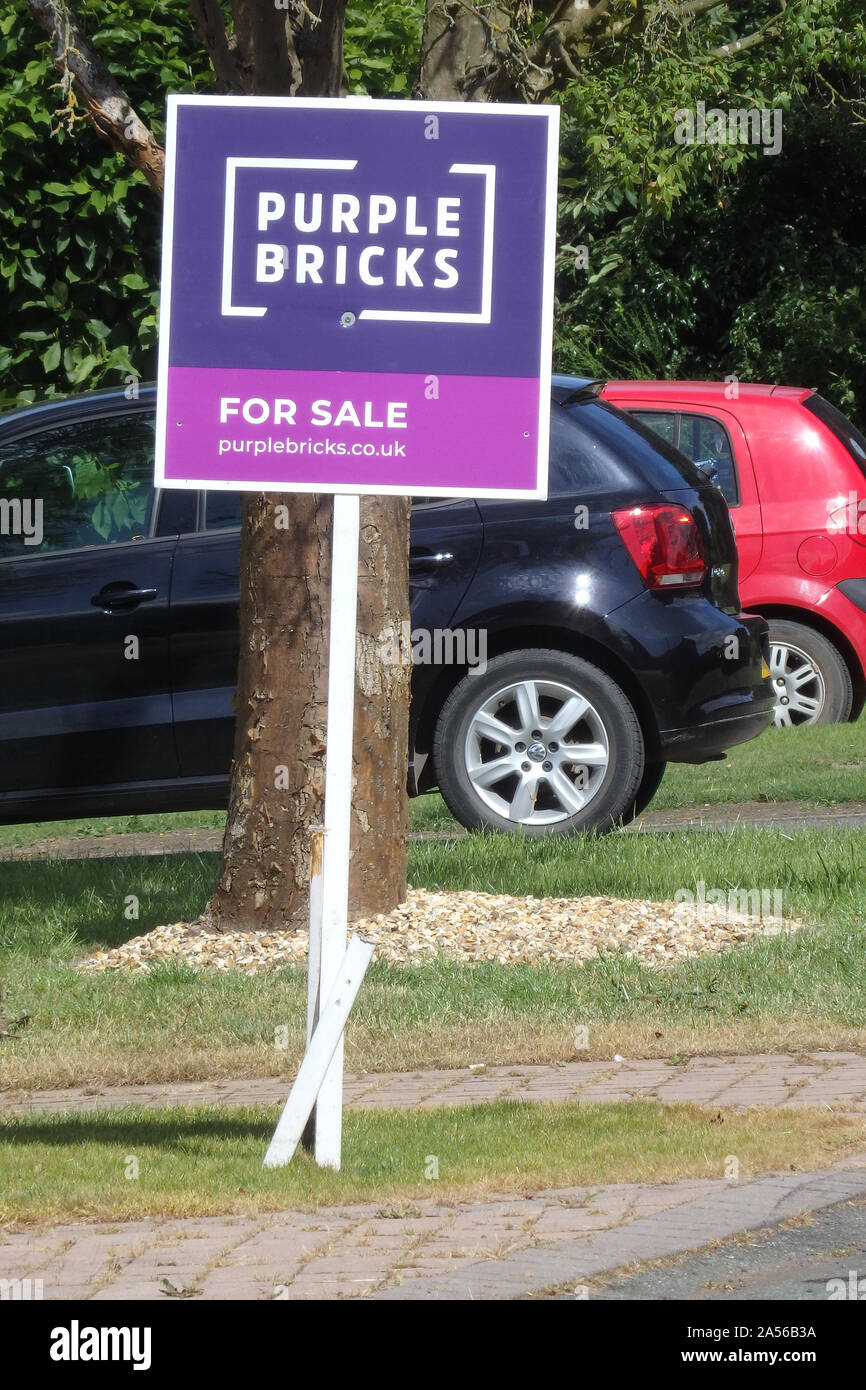 Purple Bricks Estate Agent or Realtor Sign or Board Outside a House For