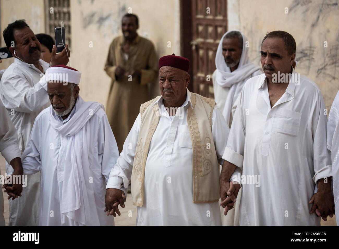 17 October 2019, Egypt, Siwa: Sheikh Abdelrahman al-Demery (C) head of ...