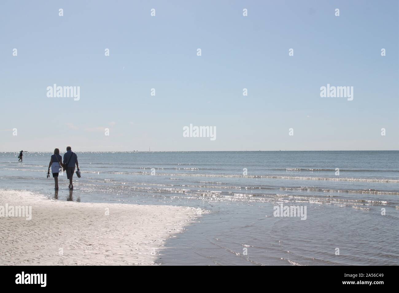 Couple holding hands beach behind hi-res stock photography and images ...