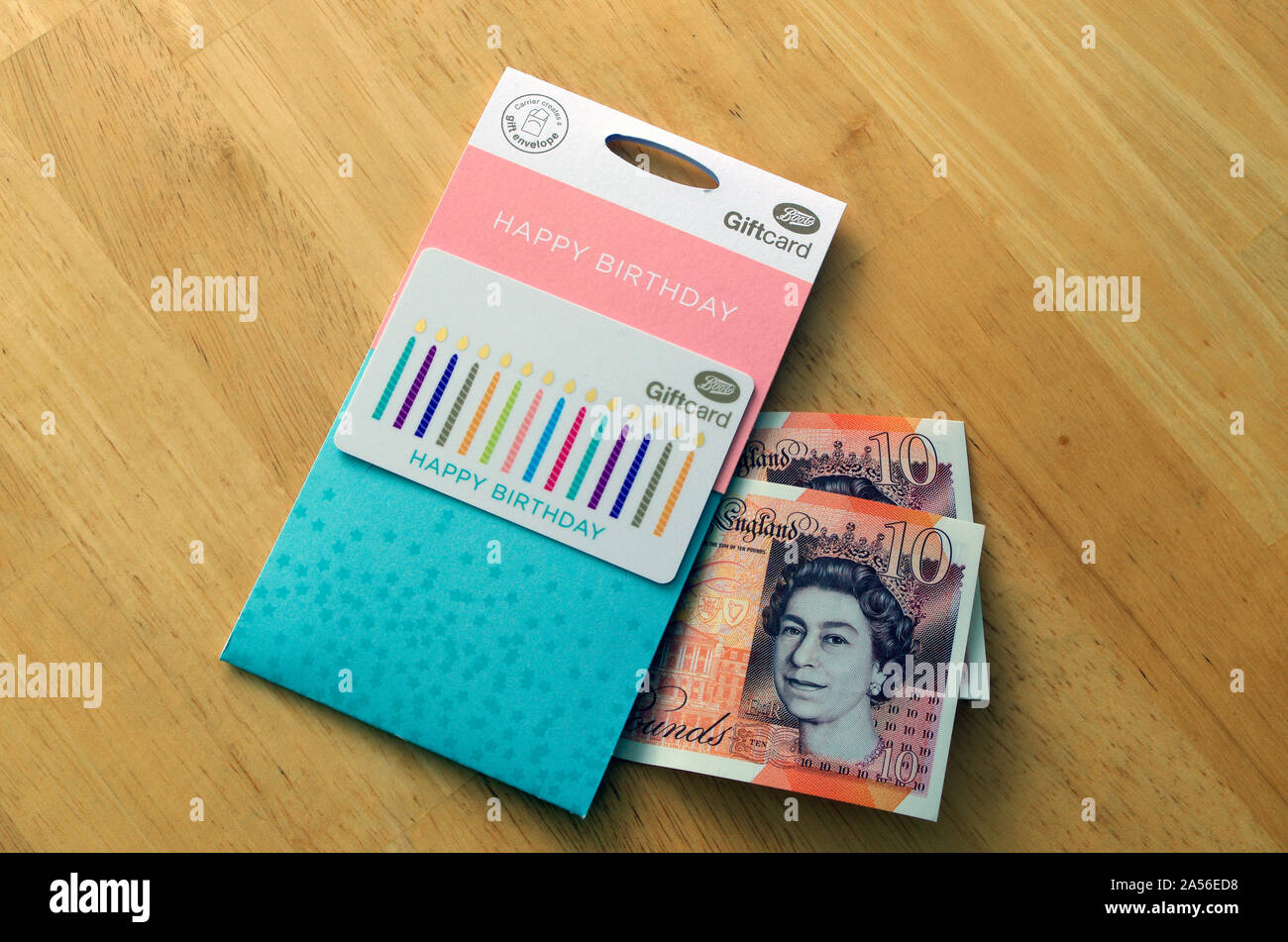 Boots the Chemist Gift Voucher or Card With Ten Pound Notes Money, UK Stock Photo