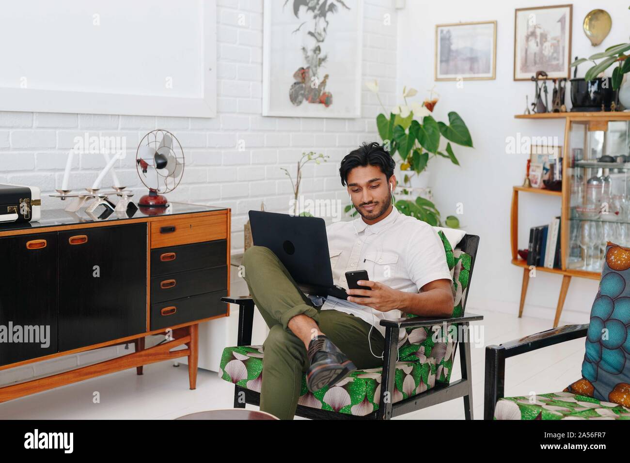 Businessman using laptop in office Stock Photo