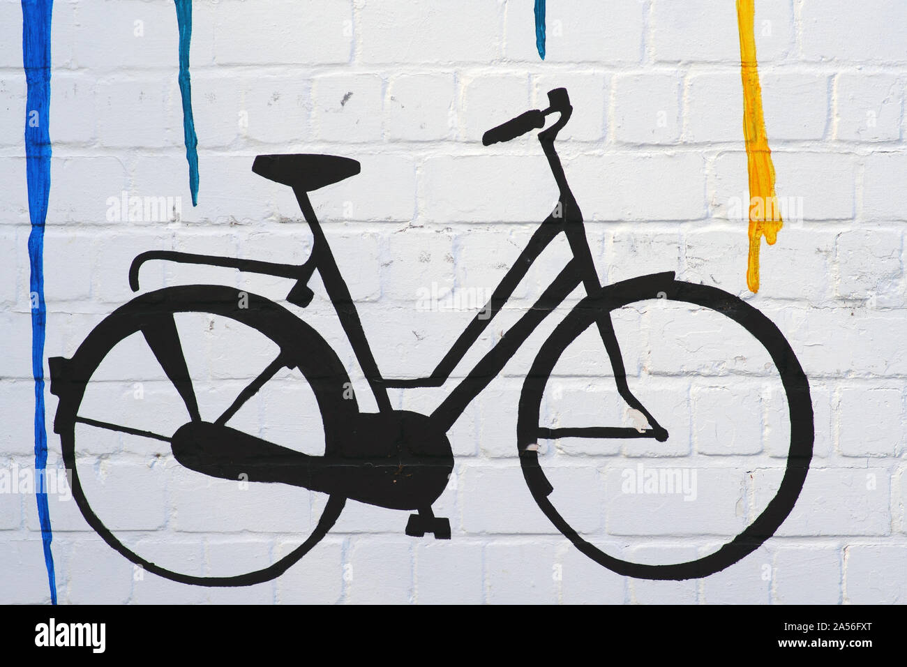 The drawing and the outline of a bicycle on a wall with color gradients. Stock Photo
