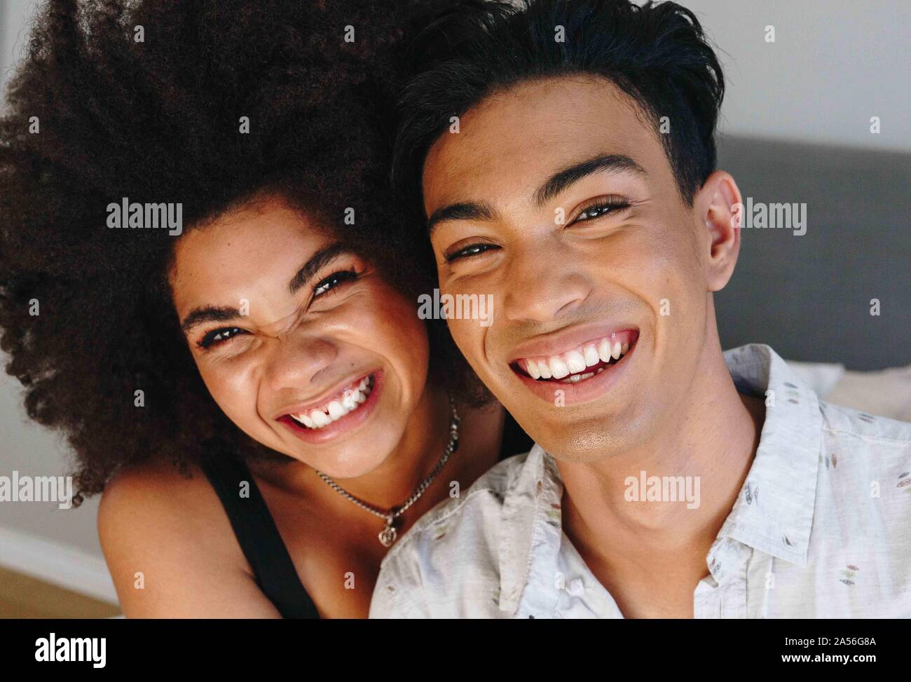 Happy young woman and boyfriend, head and shoulder portrait Stock Photo