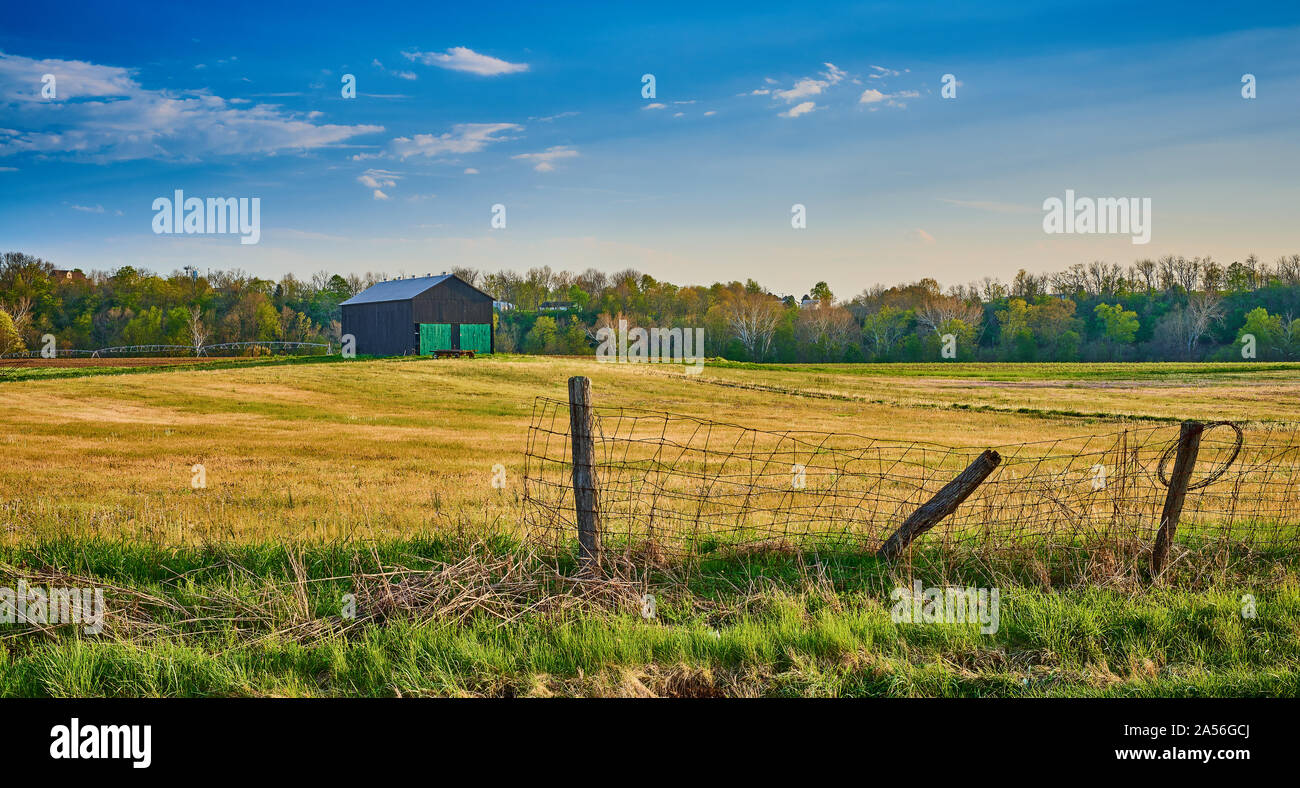 Barn with Old Wire Fence. Stock Photo