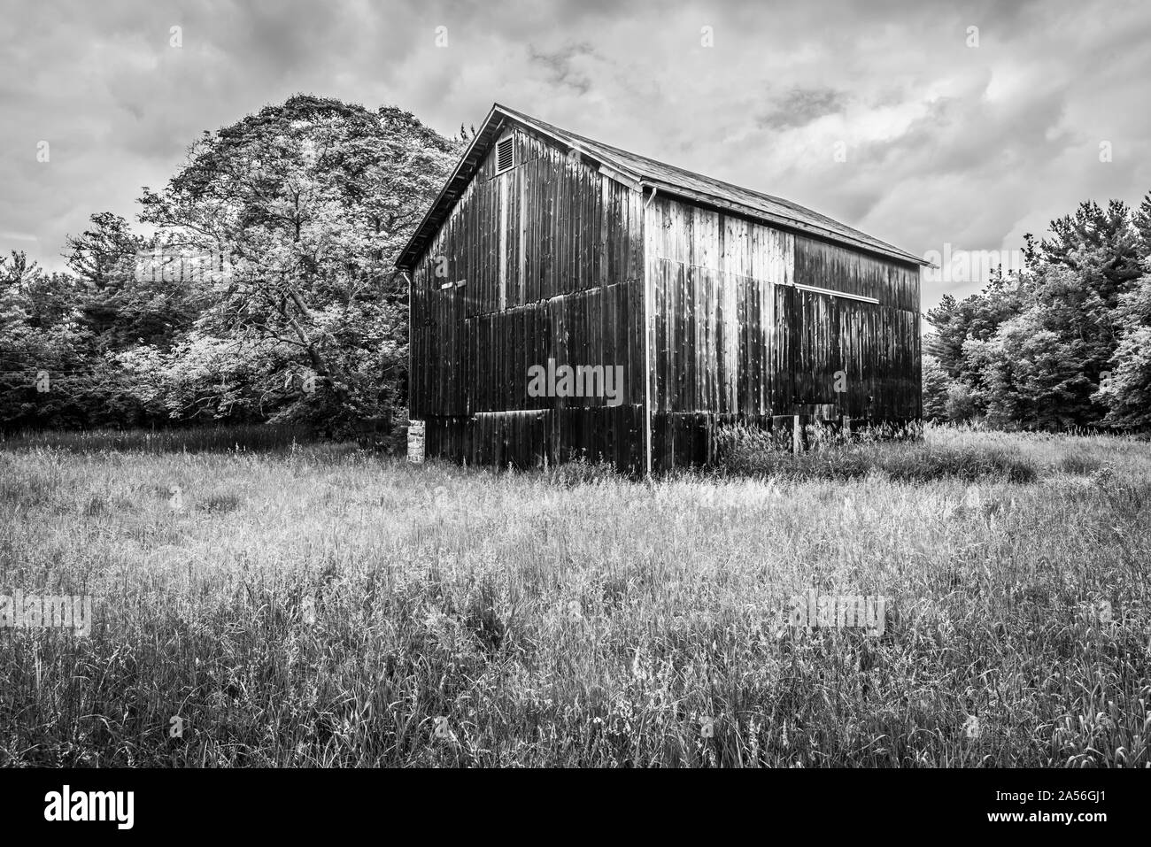 Old Barn Along Valley Trail, B&W. Stock Photo