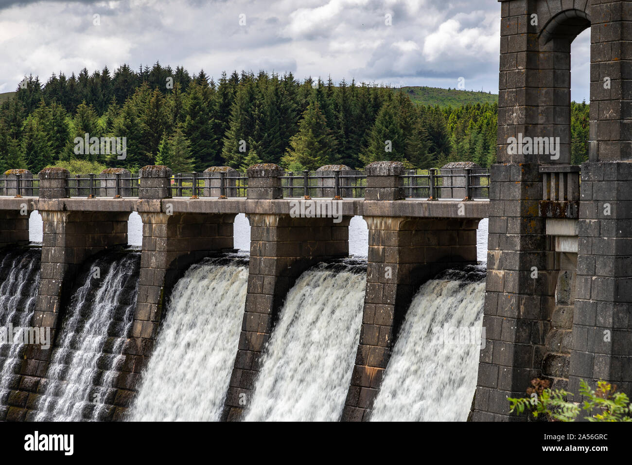 Water overflowing the dam at Alwen reservoir in North Wales Stock Photo