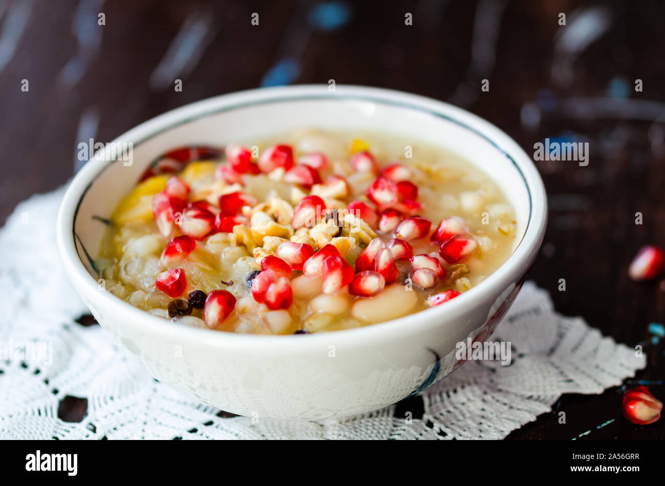 Traditional Turkish dessert Asure or Ashure making from the boiled cereals with dried fruits and pomegranate grains. Asure Day or Ashura Day is the te Stock Photo