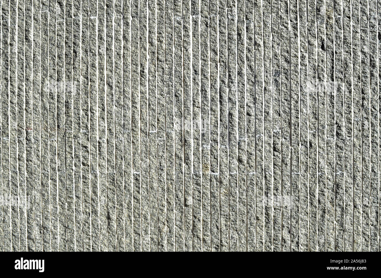 White and gray textured surface with vertical shadow lines. Stock Photo