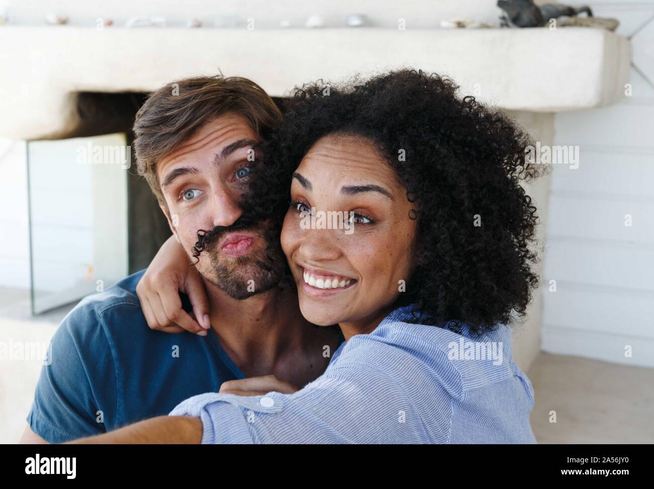 Couple taking selfie in beach house Stock Photo