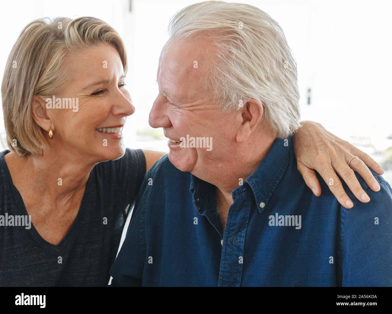 Loving senior couple talking at home Stock Photo