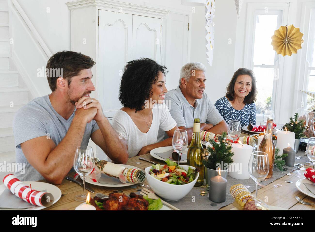 Family talking and bonding at home party Stock Photo