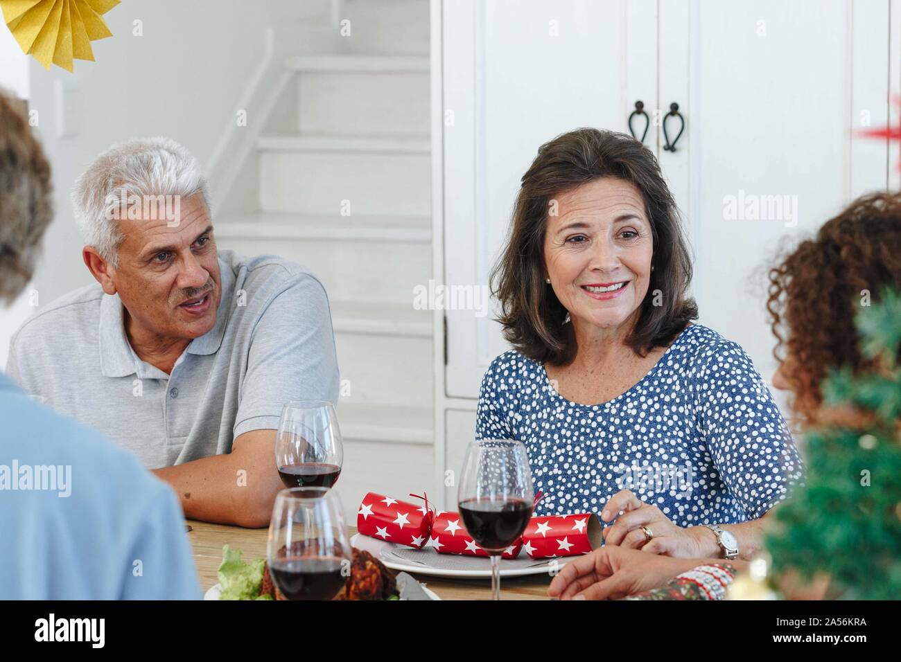 Family talking and bonding at home party Stock Photo