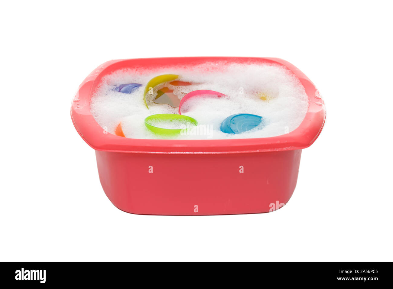 Pink washing up bowl on isolated white background Stock Photo