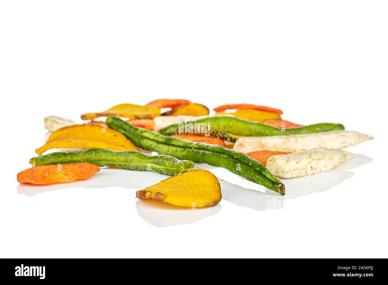 Lot of whole dry vegetable chip in large group isolated on white