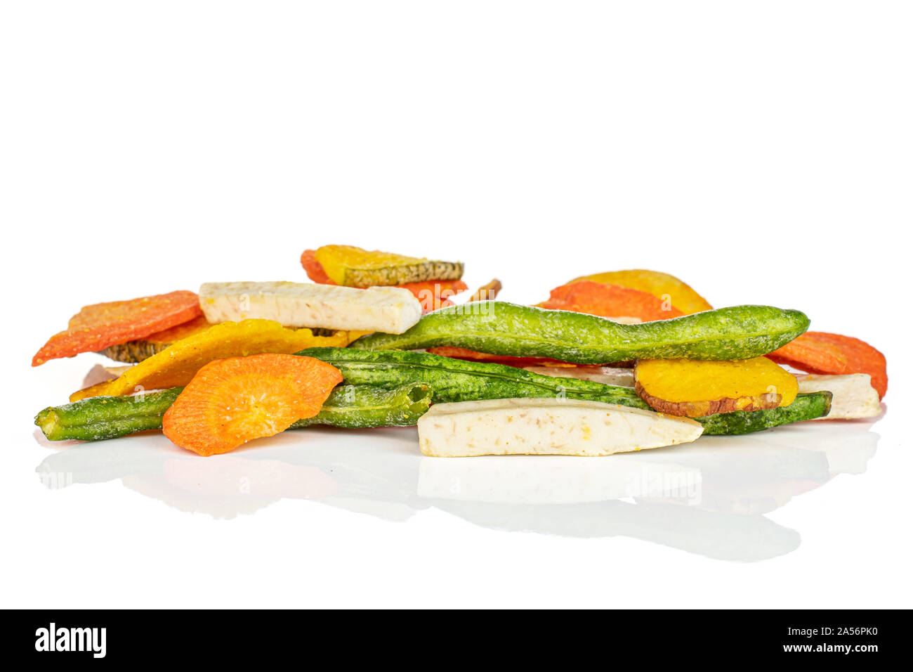 Lot of whole dry vegetable chip in large group isolated on white