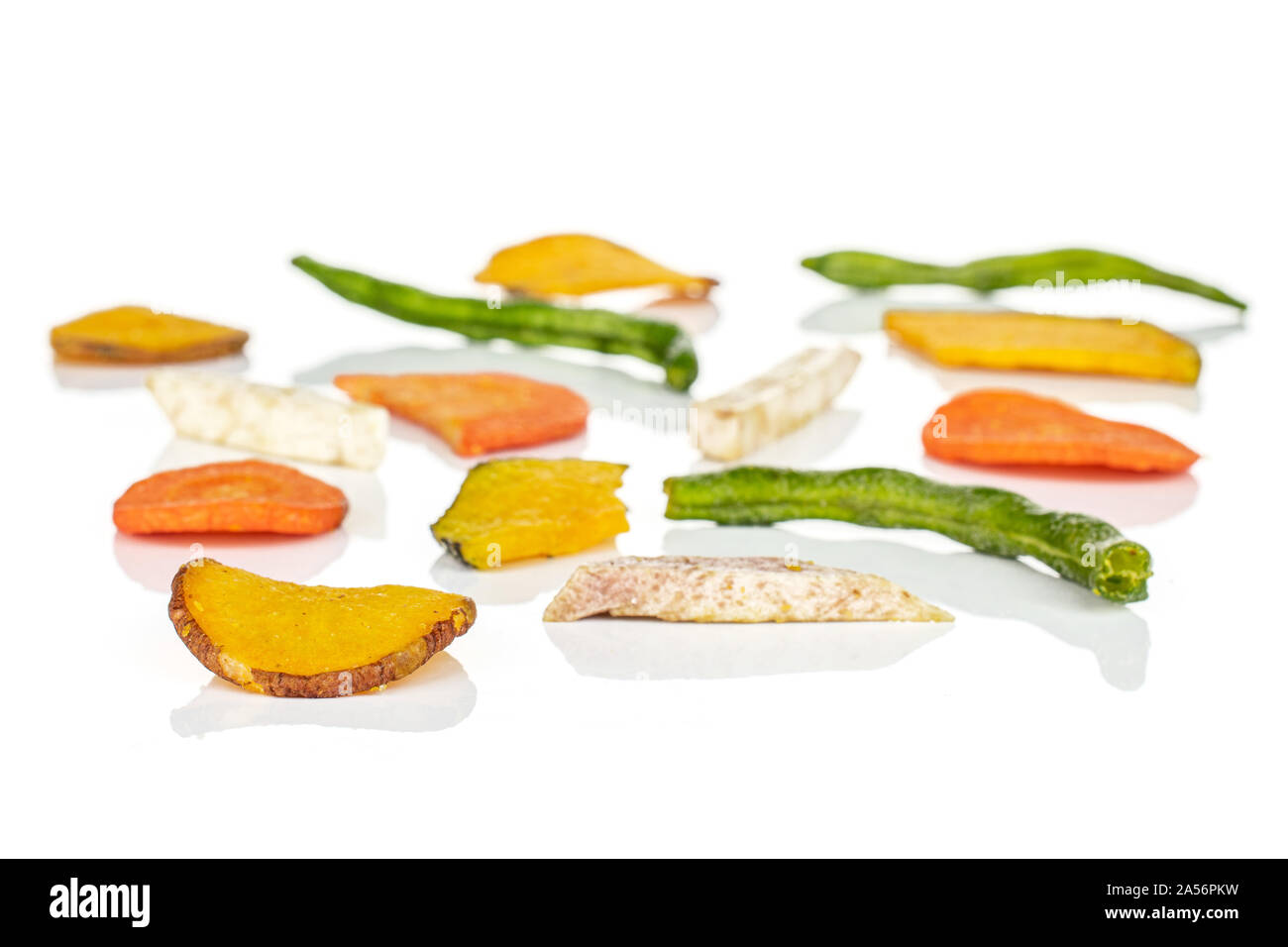 Lot of whole dry vegetable chip isolated on white background Stock