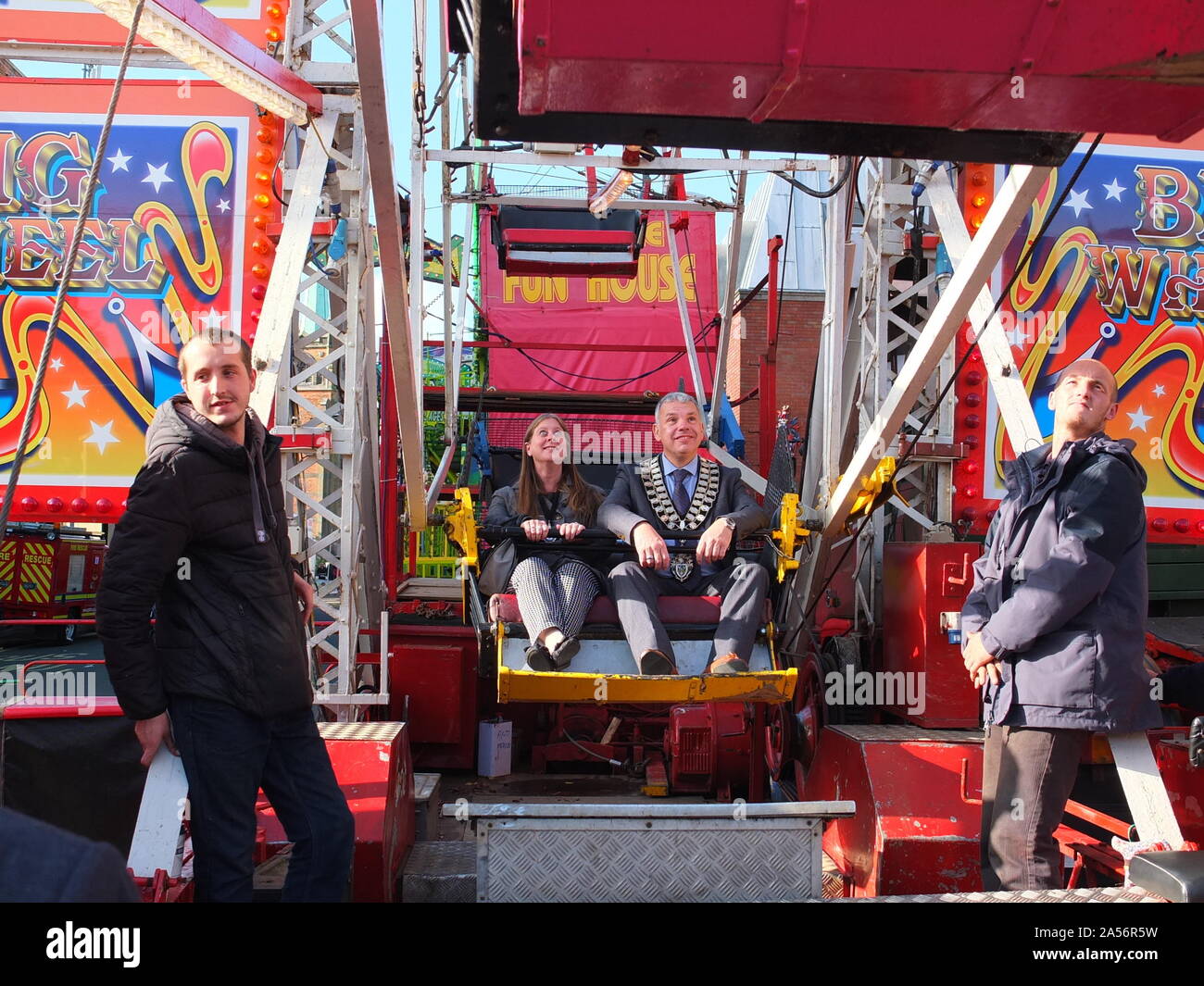 Civic dignitaries ride the big wheel at the 2019 opening of Ilkeston Charter Fair in Derbyshire which received its charter in 1252. Stock Photo