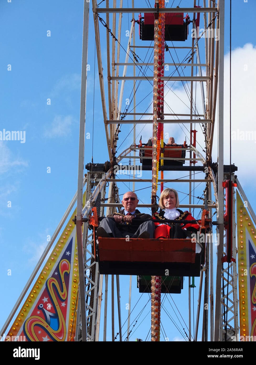 Mayor of Ilkeston Sue Beardsley rides the big wheel at Ilkeston Charter Fair in Derbyshire which received its charter in 1252. Stock Photo