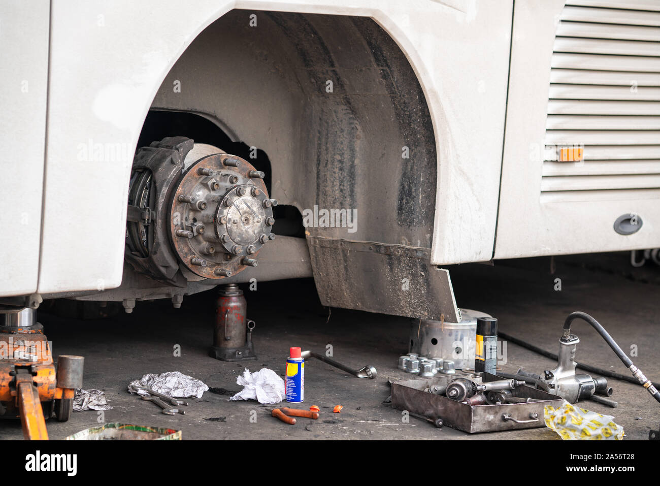 Bus is waiting in garage for fixing the maintenance. Stock Photo
