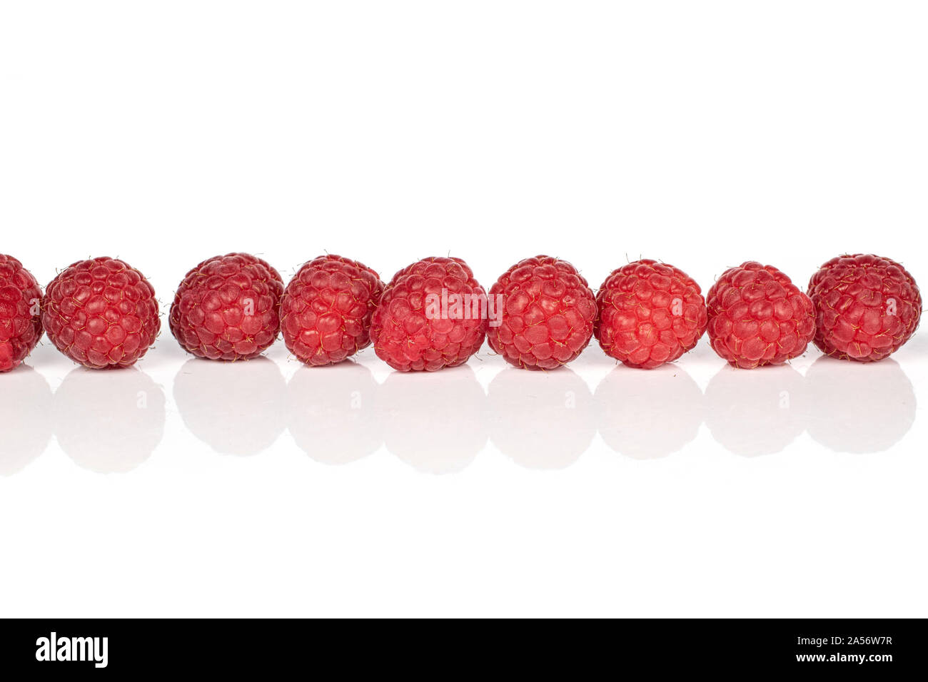 Group of nine whole fresh red raspberry isolated on white background ...
