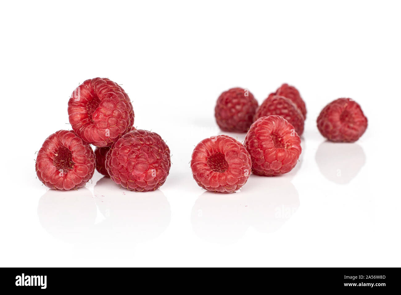Group of nine whole fresh red raspberry isolated on white background ...