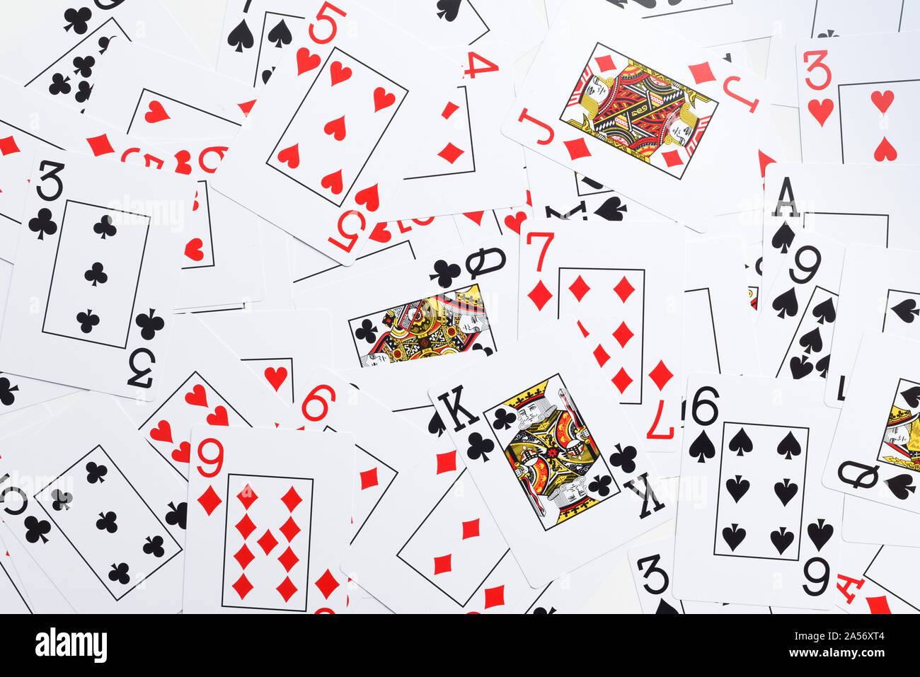 Deck of playing cards shuffled at random shot from directly above Stock Photo