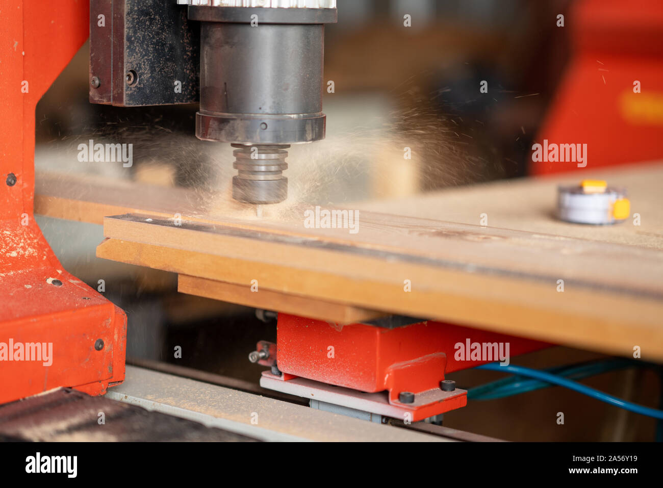 CNC Lathe machine working on wood to lathe and shaping. Stock Photo