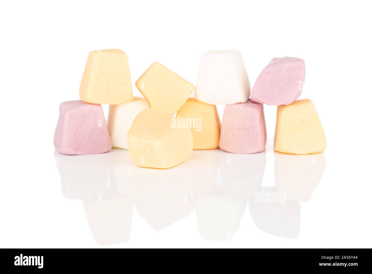 Lot of whole soft pastel candy wall isolated on white background Stock Photo