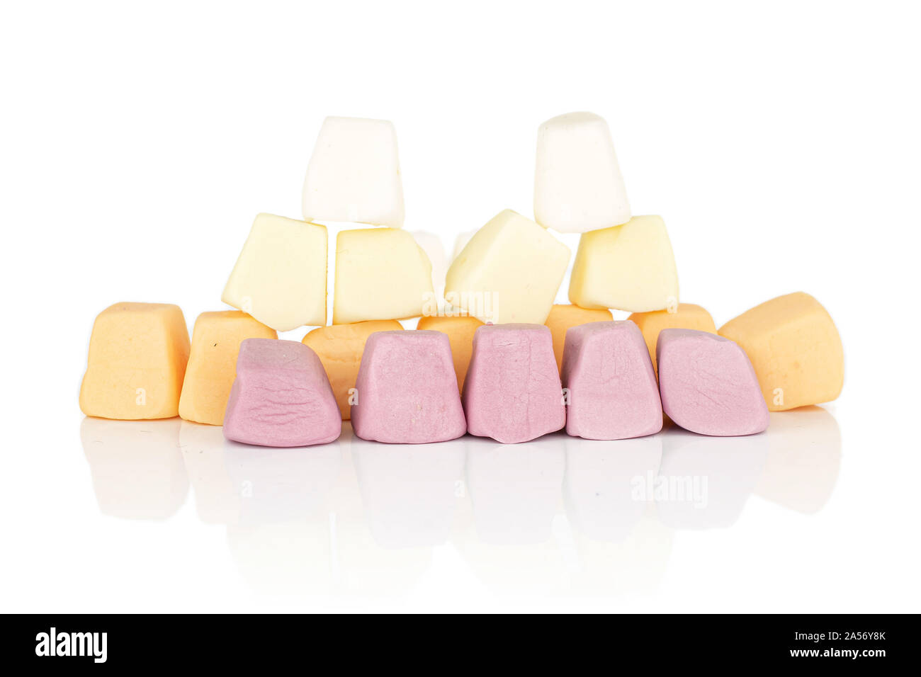 Lot of whole arranged soft pastel candy isolated on white background Stock Photo
