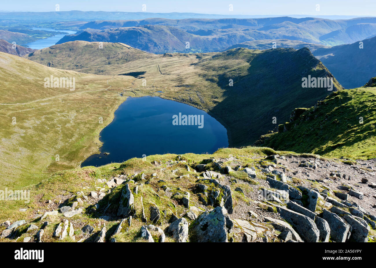 Red Tarn, Ullswater and Striding Edge seen from the summit of  Helvellyn, Lake District, Cumbria Stock Photo