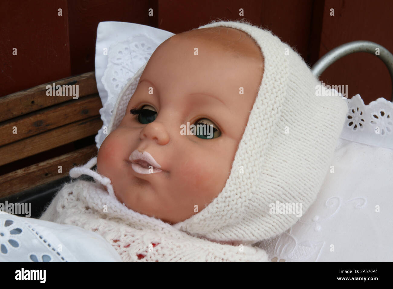 Baby doll in warm clothes Stock Photo