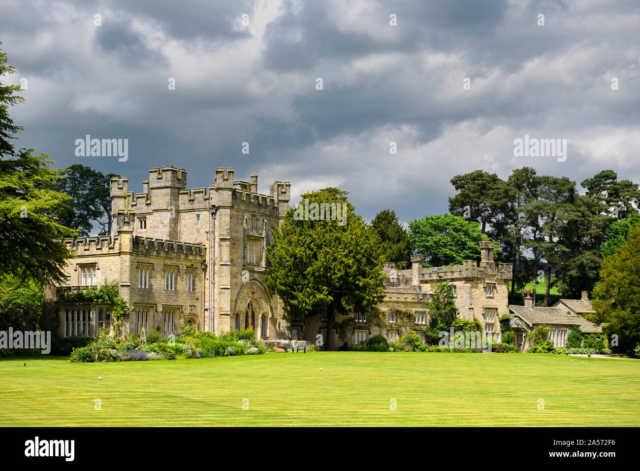 Bolton Abbey Hall original gatehouse to Bolton Priory in sun with clouds Bolton Abbey Wharfedale North Yorkshire England Stock Photo