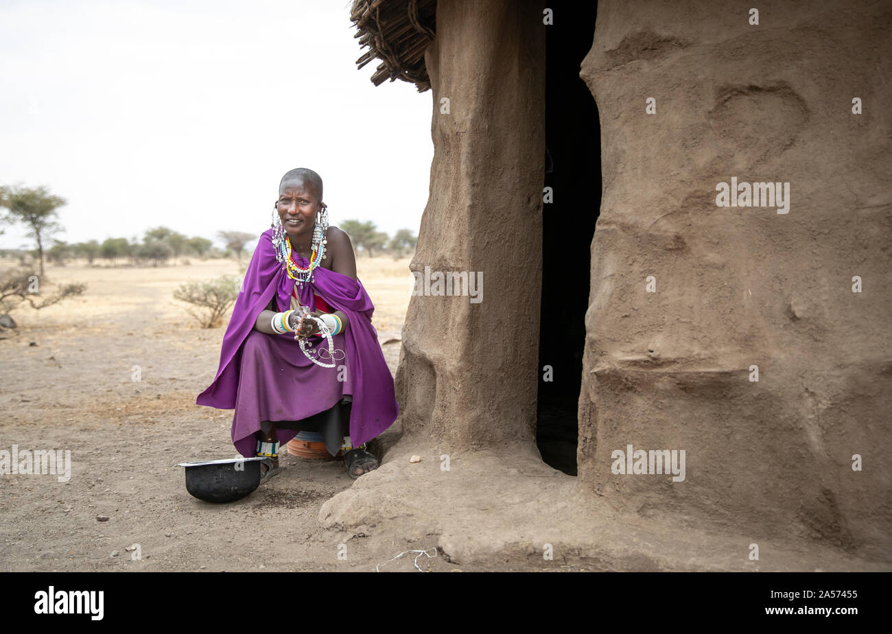 Arusha, Tanzania, 8th September 2019: maasai woman outside a maasai home Stock Photo