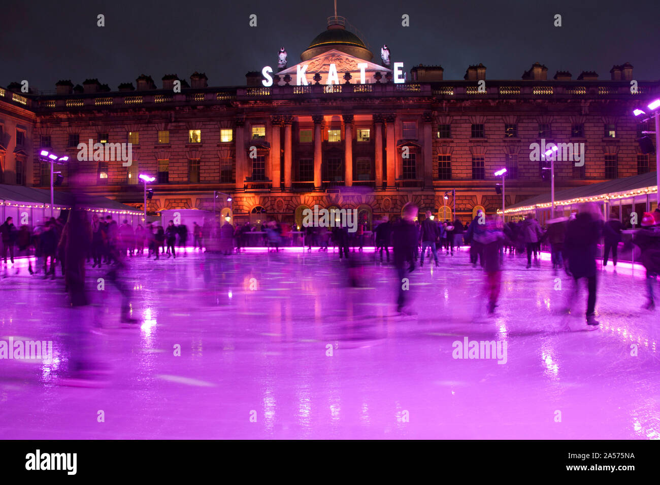 Ice skating on the winter ice rink in Christmas week, Somerset House, London, England, United Kingdom, Europe Stock Photo