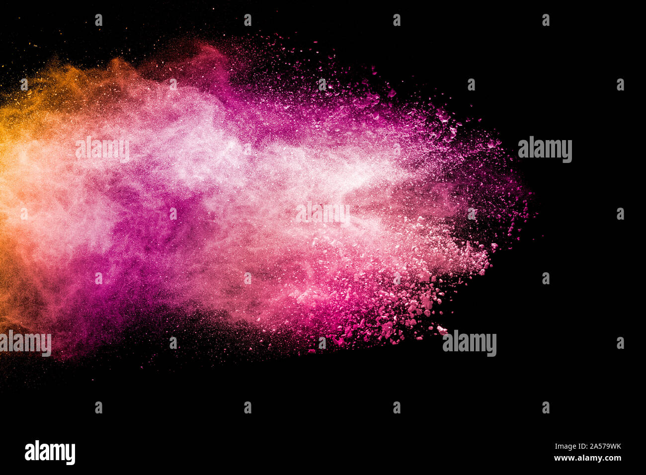 Abstract pink and orange powder explosion on black background. Freeze ...