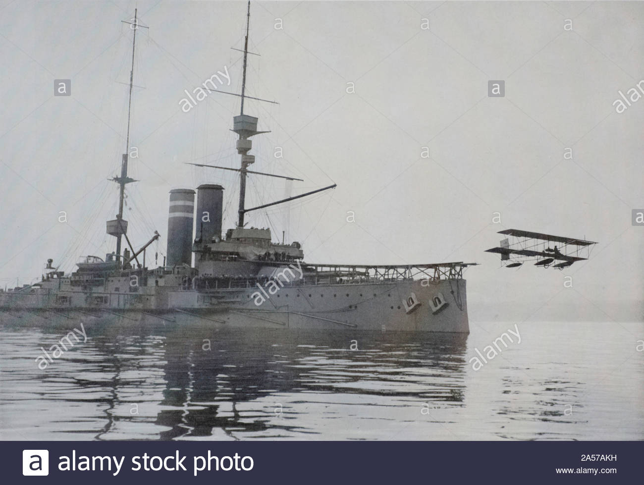 A WW1 British biplane seaplane leaves a British battleship cruiser during the raid on Cuxhaven Germany, on Christmas day 1914, vintage photograph from 1914 Stock Photo