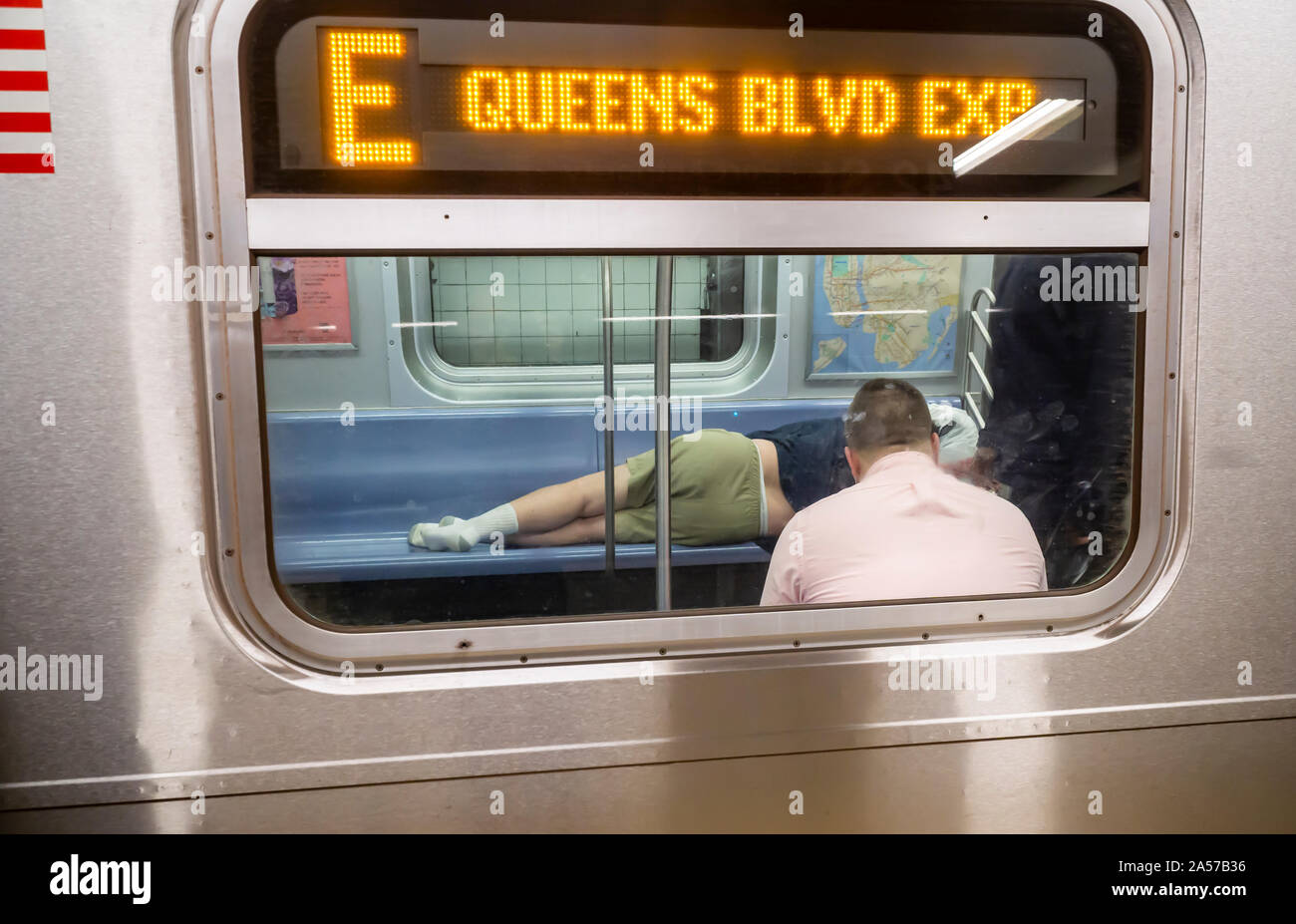 Homeless man sleeping in subway hi-res stock photography and images - Alamy