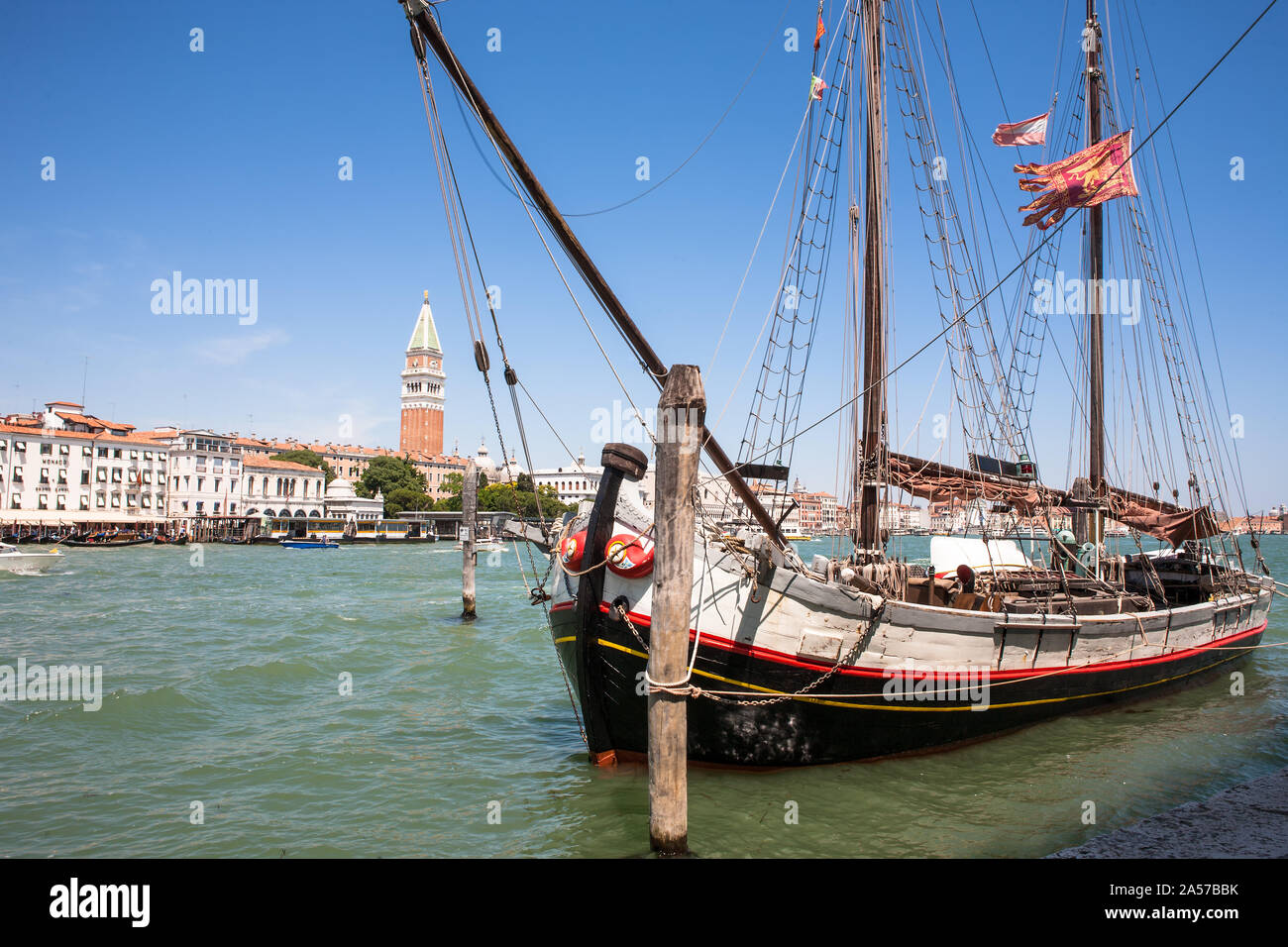 Old schooner-rigged trabaccolo 'IL Nuovo Trionfo', moored at the Dogana da Mar at the entrance to the Grand Canal, Dorsoduro, Venice, Italy Stock Photo